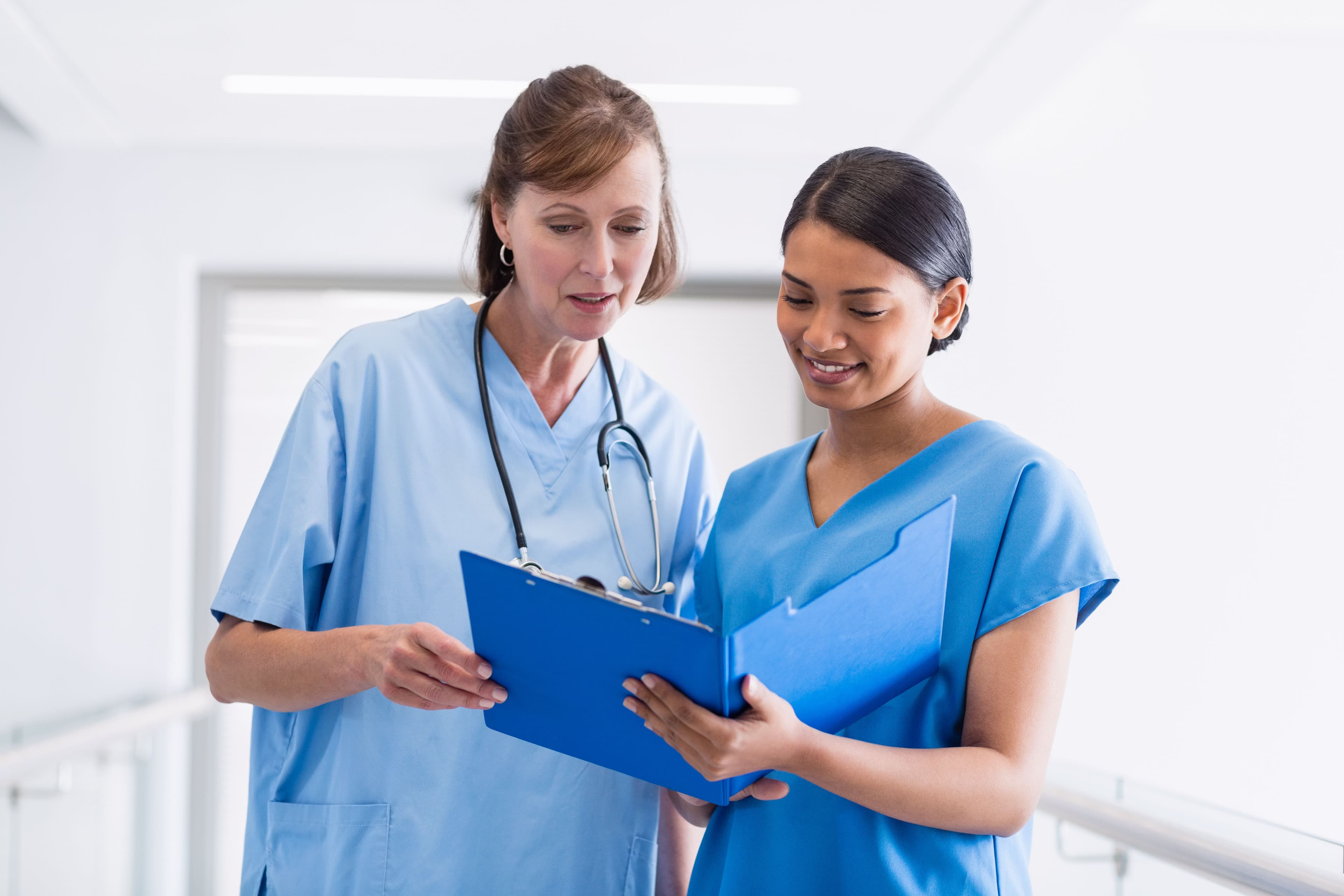 Two medical workers observing a chart